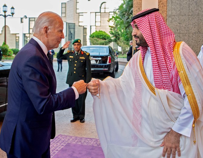 A handout picture released by the Saudi Royal Palace on July 15, 2022, shows Saudi Crown Prince Mohammed bin Salman (R) bumps fists with US President Joe Biden at Al-Salam Palace in the Red Sea port of Jeddah. (AFP)