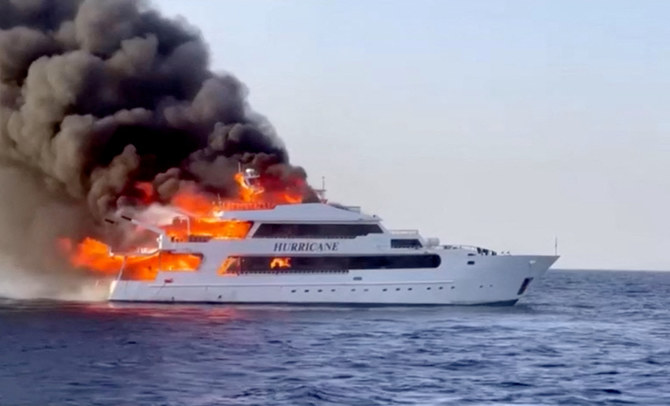 Plumes of smoke erupt from a yacht on fire in Marsa Alam, Egypt, June 11, 2023 in this screengrab. (Reuters)