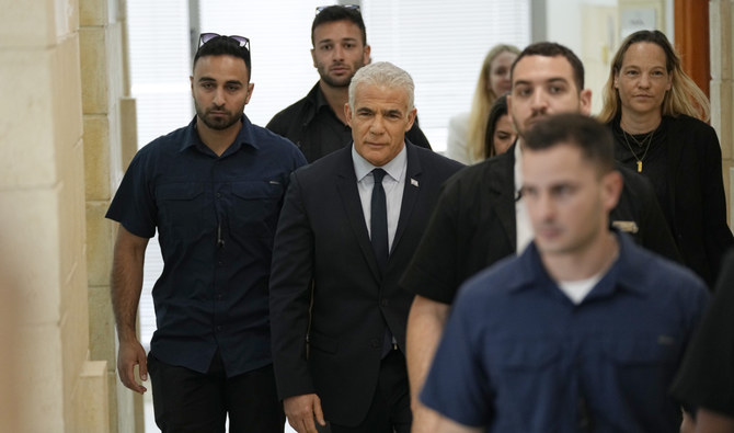 Israeli opposition leader Yair Lapid arrives to testify at the trial of Prime Minister Benjamin Netanyahu on corruption charges at the Jerusalem District Court, in east Jerusalem, Monday, June 12, 2023. (AP)
