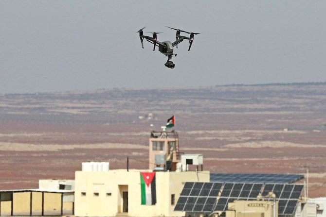 A picture taken during a tour origanized by the Jordanian Army shows a drone flying over an observation post along the border with Syria, on February 17, 2022. (AFP)
