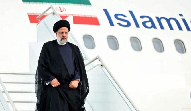 Handout picture released by Nicaragua's Presidency showing Iran's President Ebrahim Raisi disembarking from the plane upon landing at Augusto C. Sandino International Airport in Managua on June 13, 2023. (AFP)