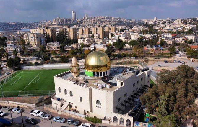 Municipality officials had ordered the removal of the structure at Al-Rahman Mosque in Beit Safafa, but following legal representations and consultations with locals it was agreed that the dome’s height would be reduced, and its color changed to silver. (Twitter/@ytirawi)
