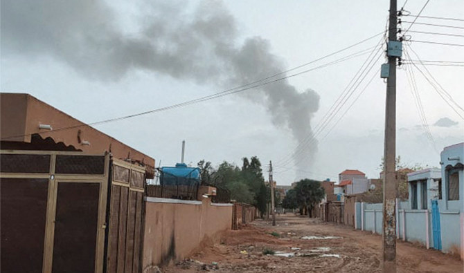 Smoke billows in the distance amid ongoing fighting in Khartoum on June 13, 2023. (AFP)