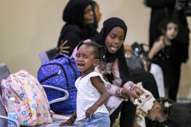 Evacuees from Sudan wait upon arrival at Baghdad International Airport on June 18, 2023. (File/AFP)