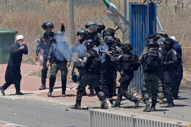 Israeli security forces clash with members of the Druze community during a protest in their village of Masada in the Israel-annexed Golan Heights (AFP)