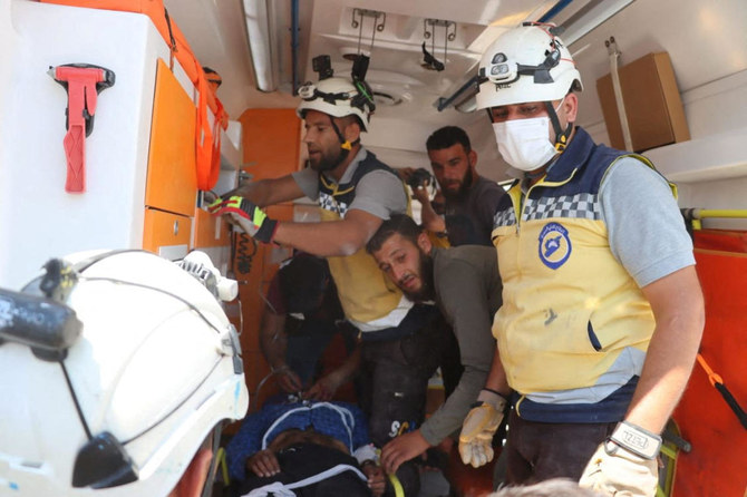 Members from White Helmets volunteer, in the aftermath of a Russian air strike at Jisr al-Shughour, Syria June 25, 2023. (Reuters)