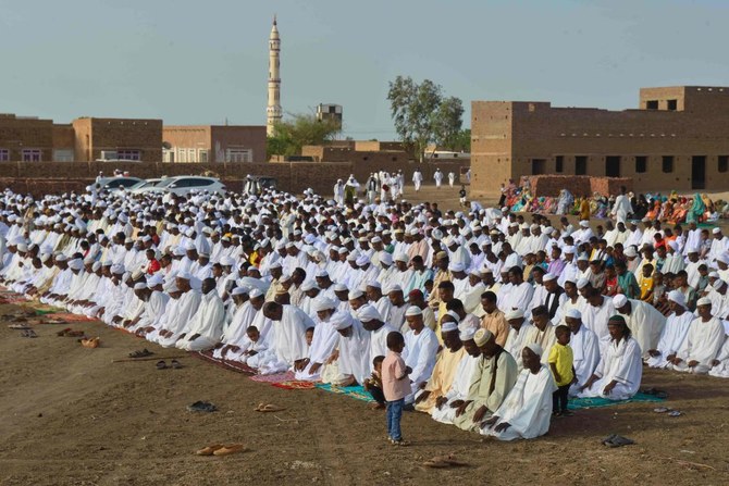 Sudanese Muslim worshippers who fled violence in Khartoum, gather for Eid al-Adha morning prayers on June 28, 2023, in the region of Jazira, south of Khartoum. (AFP)