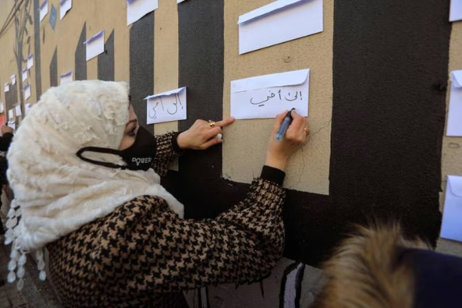 Families and relatives of Syrian detainees and missing people demand information on their loved ones, in the town of Azaz in Aleppo province. (AFP)