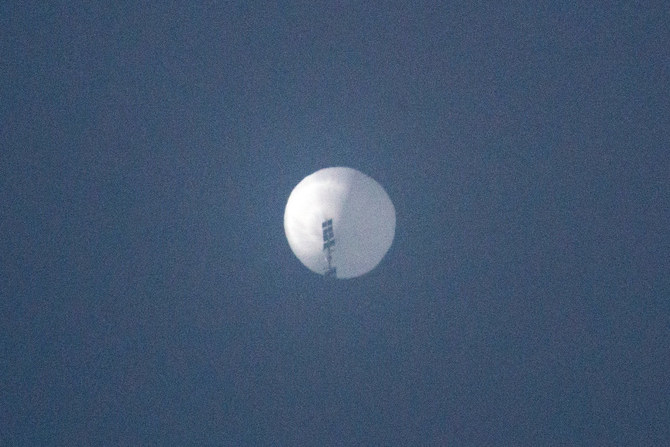 This handout photo from Chase Doak taken on February 1, 2023 shows a suspected Chinese spy balloon in the sky over Billings, Montana. (Chase Doak / AFP)