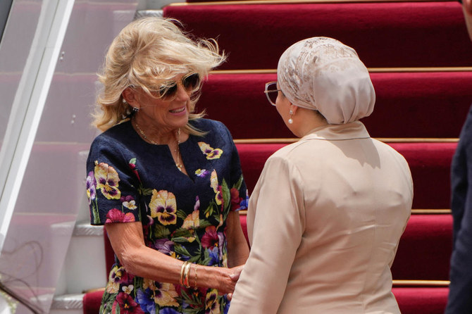 US first lady Jill Biden is greeted by Egyptian first lady Entissar Mohameed Amer as she arrives at Cairo International Airport (REUTERS)