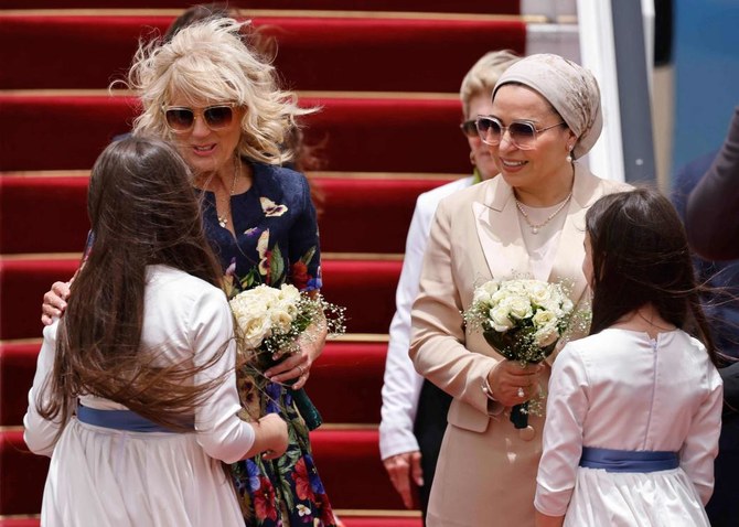 Egyptian first lady Entissar Amer (R) welcomes US First Lady Jill Biden at Cairo international Airport (AFP)