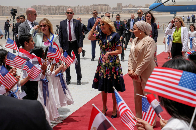 US first lady Jill Biden, accompanied by Egyptian first lady Entissar Mohameed Amer, is greeted by children as arrives at Cairo International Airport in Cairo (REUTERS)