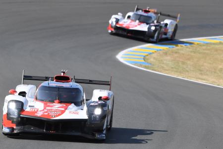 Japan's driver Kamui Kobayashi (left) competes on his Toyota GR010 Hybrid Hypercar WEC ahead of New Zealand's driver Brendon Hartley (right) on Toyota GR010 Hybrid Hypercar WEC during the test day, at Le Mans circuit, northwestern France, prior to the 100th edition of the 24 Hours of Le Mans endurance race, on June 3, 2023. (AFP)
