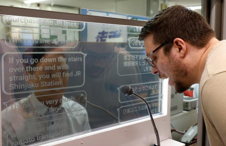 Austrian tourist Georg Riedlbaur uses an automated translation window at the Seibu-Shinjuku station in Tokyo, Japan, July 26, 2023. (Reuters)