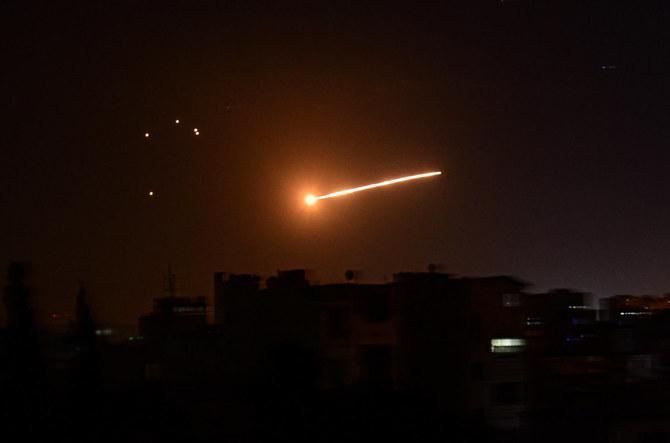 This picture released by the Syrian Arab News Agency on Feb. 24, 2020, reportedly shows Syrian air defense intercepting an Israeli missile in the sky over Damascus. SANA on Sunday said local air defenses shot down most of the Israeli missiles targetting Homs region. (AFP)