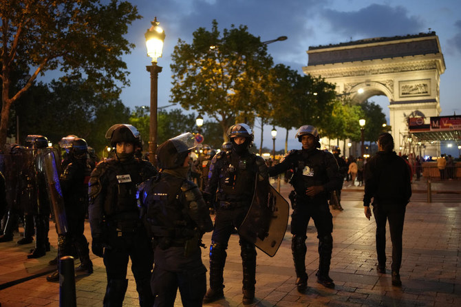 President Emmanuel Macron on Saturday scrapped an official trip to Germany after a fourth straight night of rioting and looting across France in defiance of a massive police deployment. Hundreds turned out for the burial of the 17-year-old whose killing by police triggered the unrest. (AP)