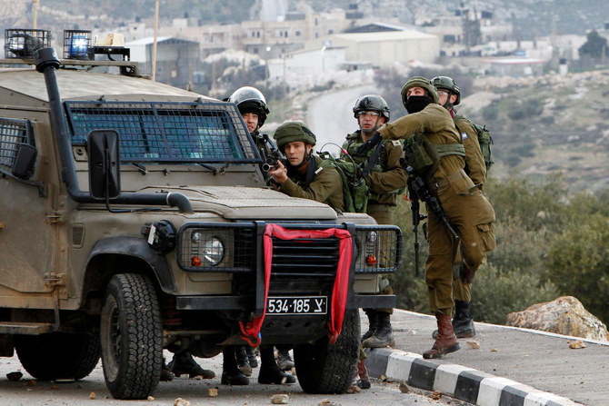 Israeli soldiers clash with Palestinian demonstrators in the West Bank village of Tuqua, south-east of Bethlehem. (AFP file photo)