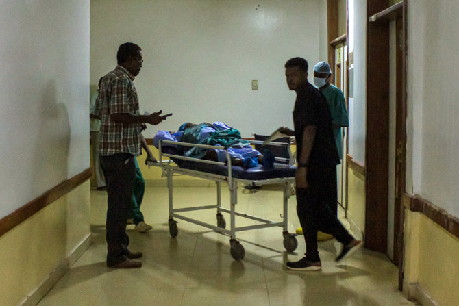 A patient is transported on a gurney at the Medani Heart Center hospital in Wad Madani, the capital of the Al-Jazirah state in east-central Sudan, on May 25, 2023, amid fighting between rival generals' forces. (AFP)