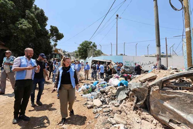 Members of an international envoys delegation tour the Jenin camp for Palestinian refugees in the Israeli-occupied West Bank on July 8, 2023. (AFP)