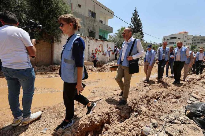 Members of an international envoys delegation tour the Jenin camp for Palestinian refugees in the Israeli-occupied West Bank on July 8, 2023. (AFP)