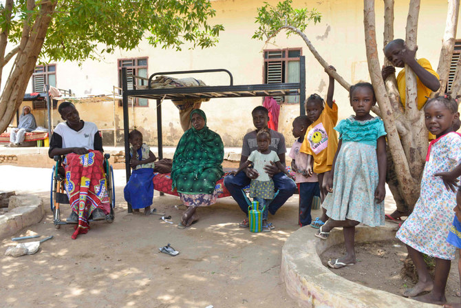 Displaced people who fled the ongoing violence by two rival Sudanese generals, gather in the courtyard of the university of al-Jazira, transformed into a makeshift shelter, in al-Hasaheisa south of Khartoum on July 8,2023. (AFP)