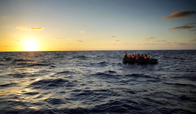 Migrants wait to be rescued by the Spanish NGO Open Arms lifeguards during a rescue operation at international waters zone of Libya SAR (Search and Rescue) in the Mediterranean sea, on Sept. 15, 2022. (AP)