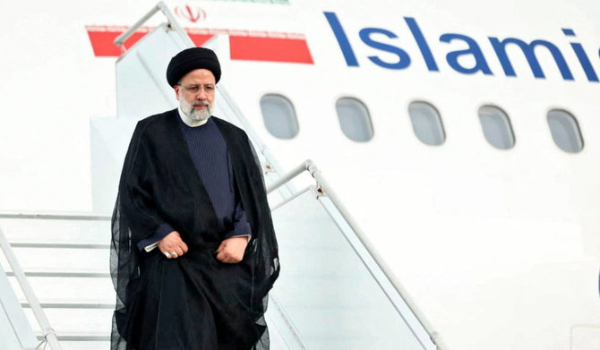 Handout picture released by Nicaragua's Presidency showing Iran's President Ebrahim Raisi disembarking from the plane upon landing at Augusto C. Sandino International Airport in Managua on June 13, 2023. (AFP)