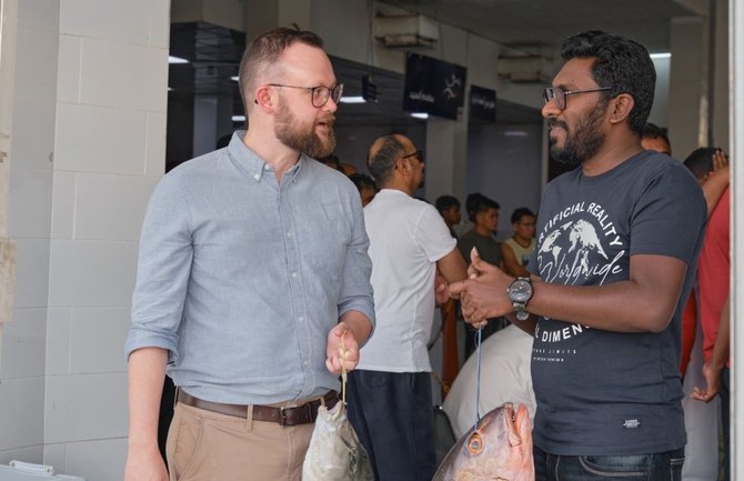 Andrew Temple, left, and Santhosh Charles, fisheries specialist at KAUST Beacon Development, go to local fish markets to gather data on different species of fish. (Supplied)