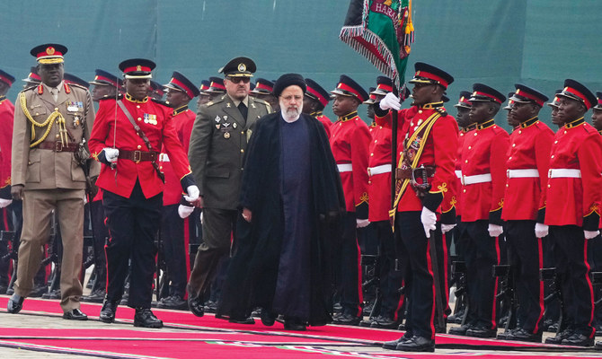 Iran’s President Ebrahim Raisi inspects guard of honor before meeting Kenya’s President William Ruto in Nairobi on Wednesday. (AP)