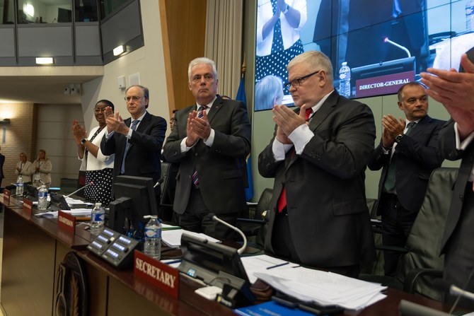 Delegates applaud the completion of the first pillar of the Chemical Weapons Convention on July 11, 2023. (Twitter/@OPCW)