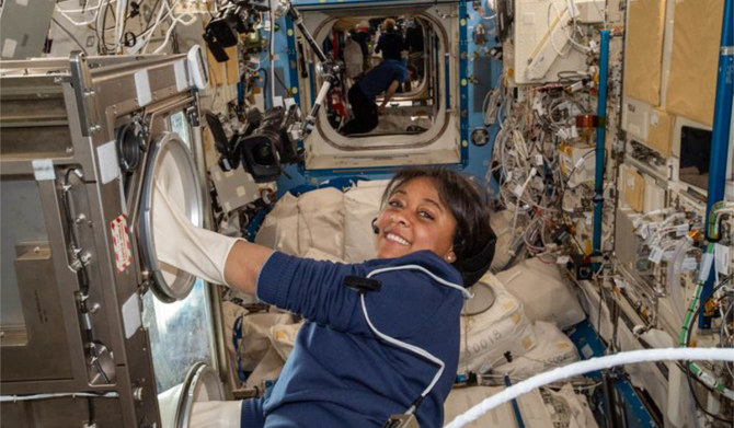 Saudi astronaut Rayyanah Barnawi using the live science gloves box to conduct experiments on human immune cells and their inflammatory response in microgravity. (AN photo)
