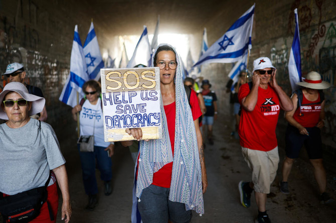 Hundreds of protesters became thousands as Israelis joined the 70-kilometer march throughout the day in a demonstration against one of Israel’s most far-right governments in history. (Reuters)