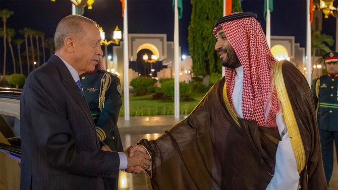 Turkish President Recep Tayyip Erdogan, left, and Saudi Crown Prince Mohammed bin Salman shake hands during a welcome ceremony in Jeddah. (AP)