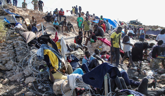 Migrants from Africa are pictured next to the seashore at the Libyan-Tunisian border in Ras Ajdir, Libya July 23, 2023. (REUTERS)