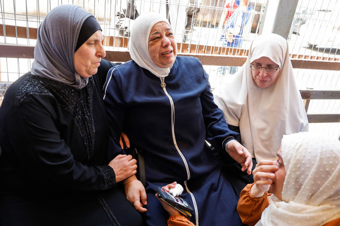People react at the hospital before the funeral of a Palestinian killed during Israeli raid, in Nablus. (Reuters)