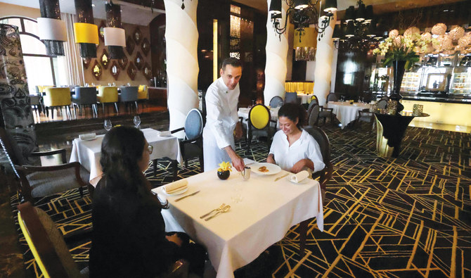 French chef Renaud Dutel serves a dish at STAY by Yannick Alleno restaurant in Dubai. (AFP)