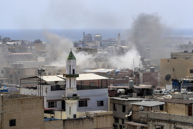 Smoke rises during clashes that erupted between members of the Palestinian Fateh group and militants in the Palestinian refugee camp of Ein el-Hilweh near the southern port city of Sidon, Lebanon, Sunday, July 30, 2023. (AFP)