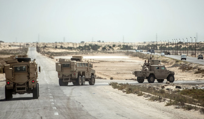 Egyptian policemen driving on a road leading to the North Sinai provincial capital of El-Arish. (AFP file photo)