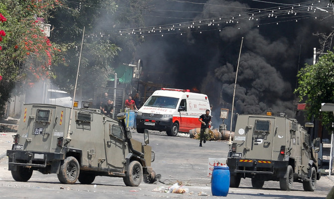 Palestinians clash with Israeli forces during an Israeli military operation in Jenin. (Reuters)