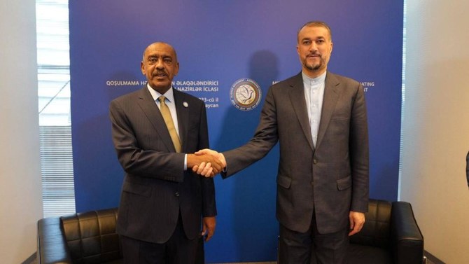 Iranian Foreign Minister Hossein Amirabdollahian shakes hands with Sudan’s acting Foreign Minister, Ali Sadeq, in Baku on Thursday. (@IRIMFA_EN)
