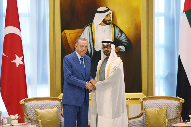UAE President Sheikh Mohamed bin Zayed Al-Nahyan shaking hands with Turkish counterpart Recep Tayyip Erdogan in Abu Dhabi. (AFP)