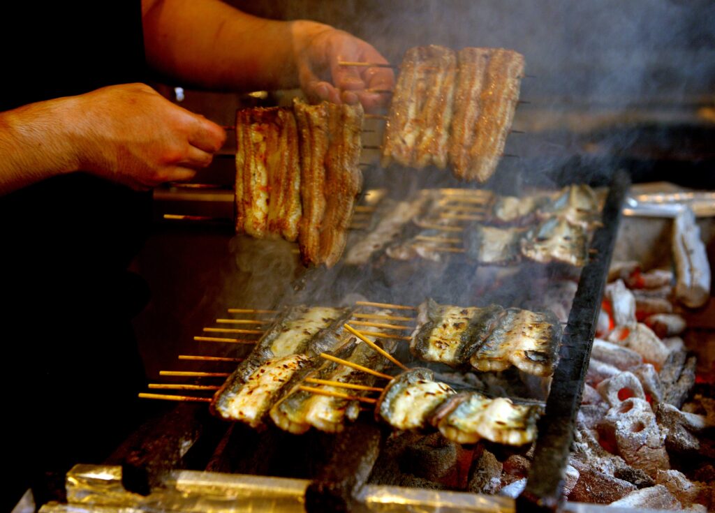 Japanese people have a tradition of eating nutritious grilled eels, believed to be good for restoring energy, on the midsummer Day of the Ox (AFP).