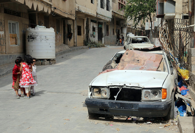 Yemen’s status as the least peaceful country in the Arab world was recorded for the third consecutive year, owing to its civil war. Above, children walk past a shrapnel-ridden vehicle in Taez, Yemen on June 9, 2022. (AFP file photo)