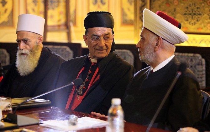 Maronite Patriarch Bechara Al-Rahi, center, has expressed his doubts about the sincerity of Lebanese politicians toward the country. (Getty Images)