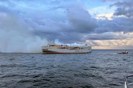 Smoke and flames are seen on a freight ship in the North Sea, about 27 kilometers (17 miles) north of the Dutch island of Ameland, Wednesday, July 26, 2023. (AP)