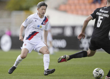 Former Japan forward Kazuyoshi Miura plays for Oliveirense in the second half of a football match against Academico de Viseu in Viseu, Portugal, on April 22, 2023. (Kyodo News via AP)