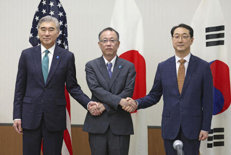 US Special Envoy for North Korea Sung Kim and his Japanese and South Korean counterparts Funakoshi Takehiro and Kim Gunn shake hands in their trilateral meeting on issues related to North Korea in Karuizawa, Nagano Prefecture, in Japan in this photo distributed by Kyodo on July 20, 2023. (Reuters)