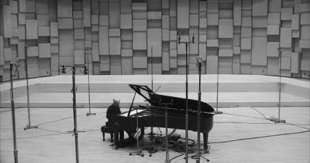In this photo provided by 2022 Kab Inc., Japanese musician Ryuichi Sakamoto performs piano in a new film Ryuichi Sakamoto’s Opus, directed by Neo Sora, which is making its world premiere at the Venice International Film Festival next month. (AP)