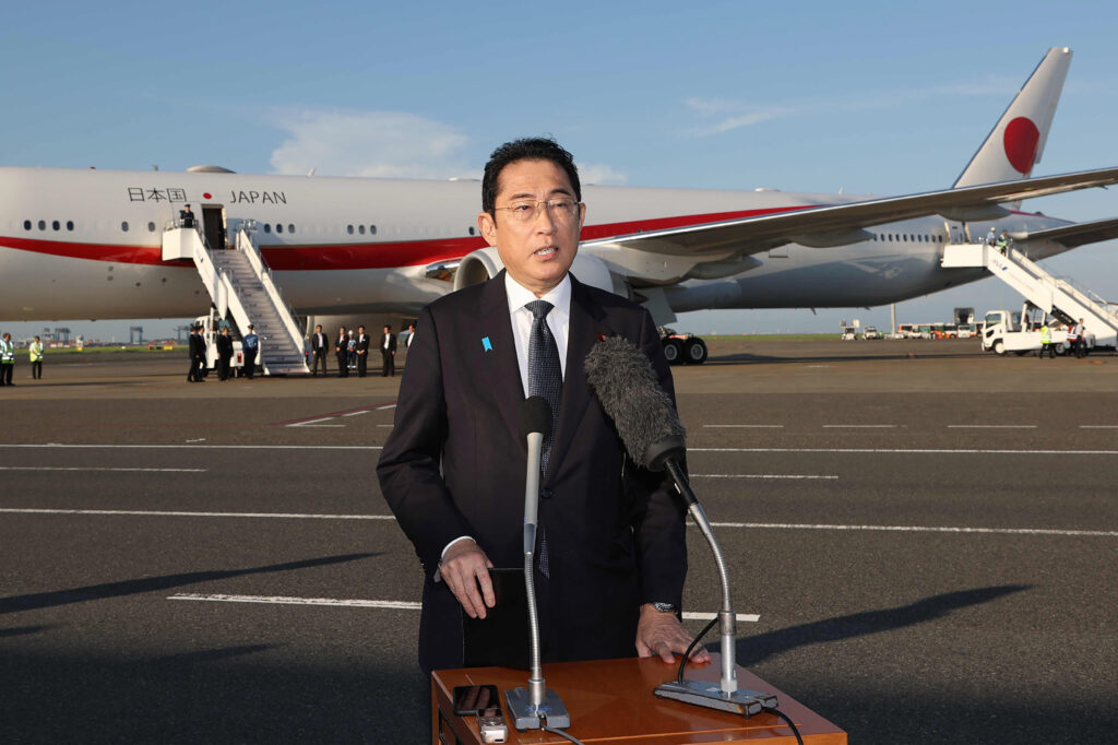 Japan's Prime Minister Fumio Kishida speaks before departing for the US for meetings with the US and South Korean leaders. (AFP)