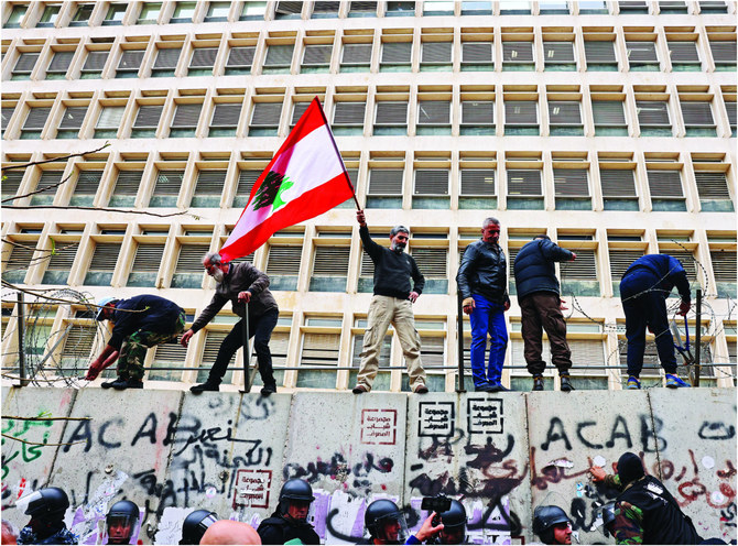 Among the many people who have held protests outside the headquarters of Lebanon’s central bank office in Beirut this year are retired soldiers, who demanded inflation adjustments to their pensions on March 30, 2023. (AFP file)